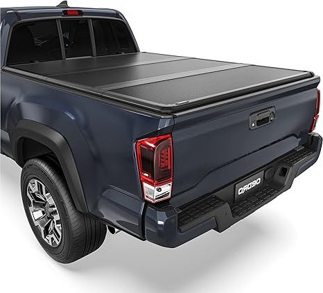 Gator tonneau cover open with gear loaded in truck