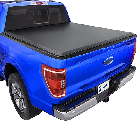 Gator tonneau cover open with gear loaded in truck